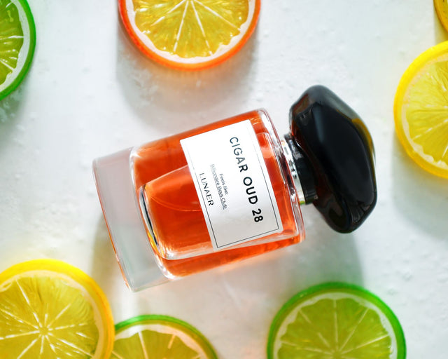Clinique Happy perfume inspired citrus floral fragrance bottle in bright natural light